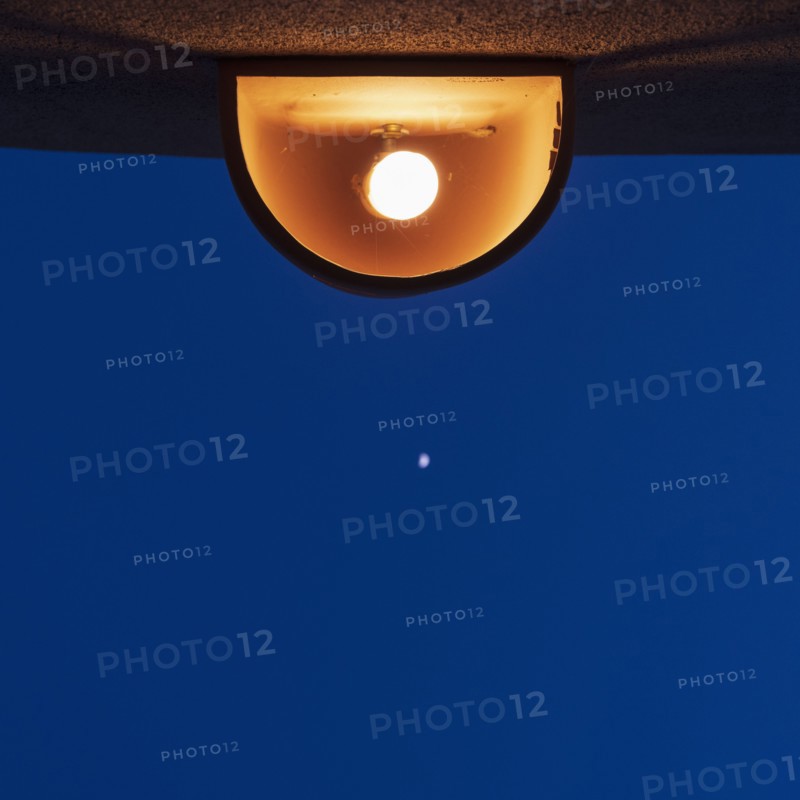 Lamp against sky at night