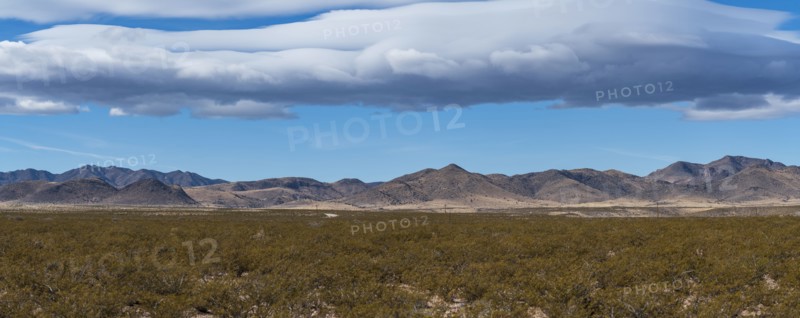 Clouds over desert landscape in Gila National Forest