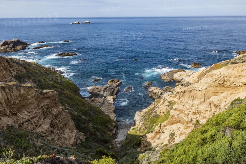 Ocean waves crashing against Big Sur coast