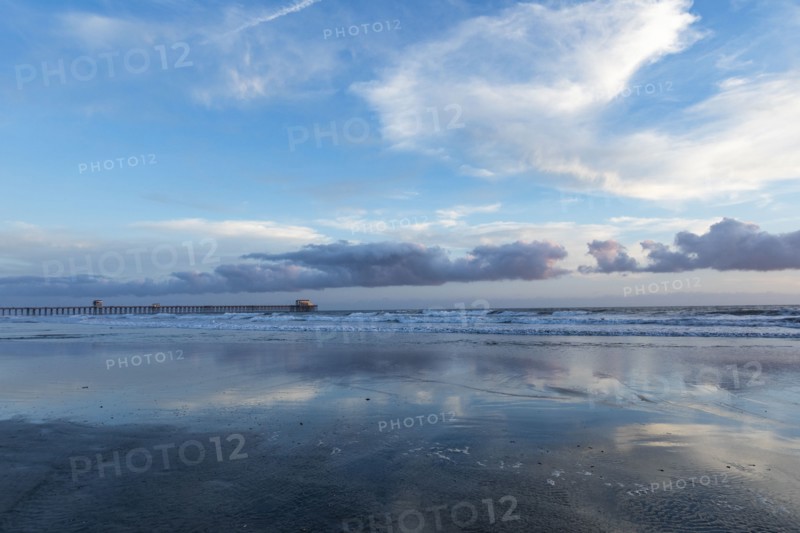 USA, California, Oceanside, Clouds reflecting in sea
