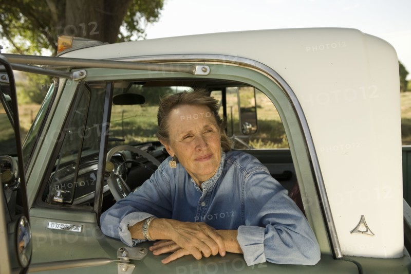 Senior woman in pick-up truck