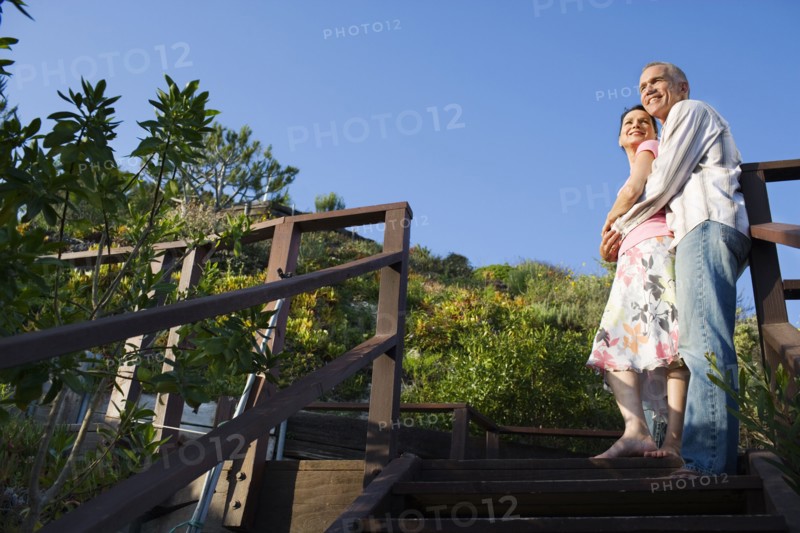 Couple hugging on wooden stairs