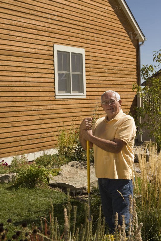 Portrait of senior man in garden