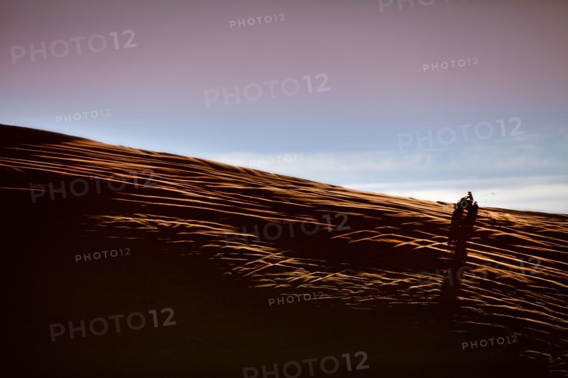 Person riding ATV in desert