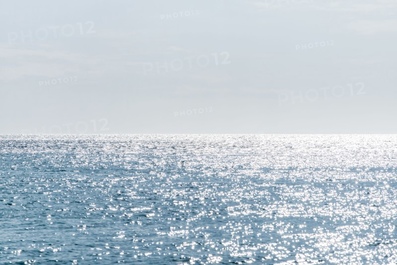 Calm sea surface reflecting sunlight
