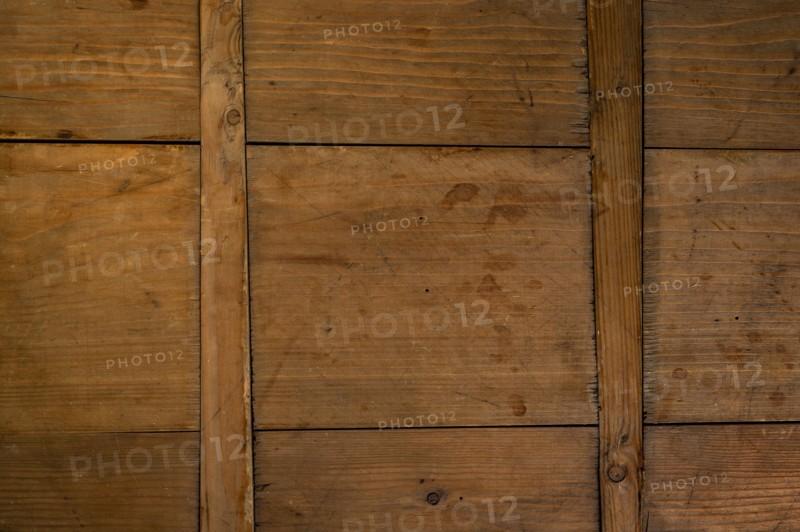 Close-up of worn antique cutting board with cross support wood slats