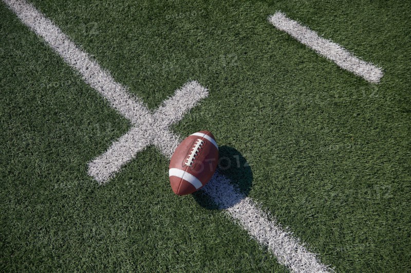 Overhead view of American football ball on field