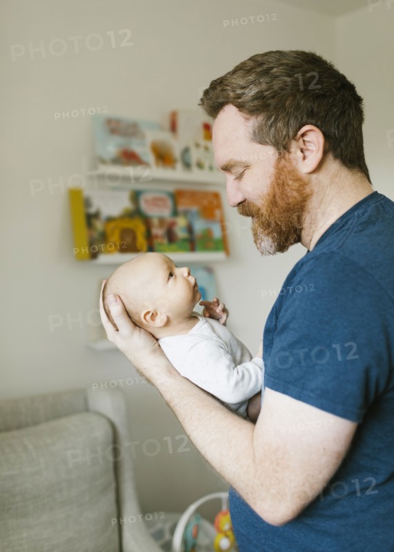 Father holding newborn son