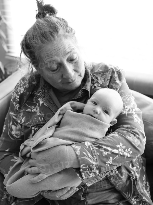 Grandmother holding newborn grandson