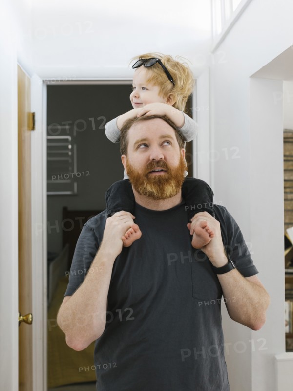 Father carrying son