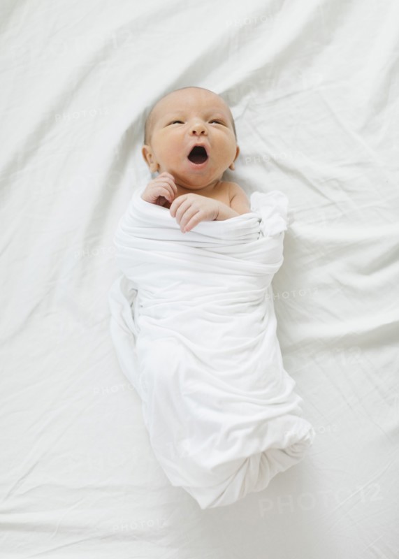 Swaddled newborn boy