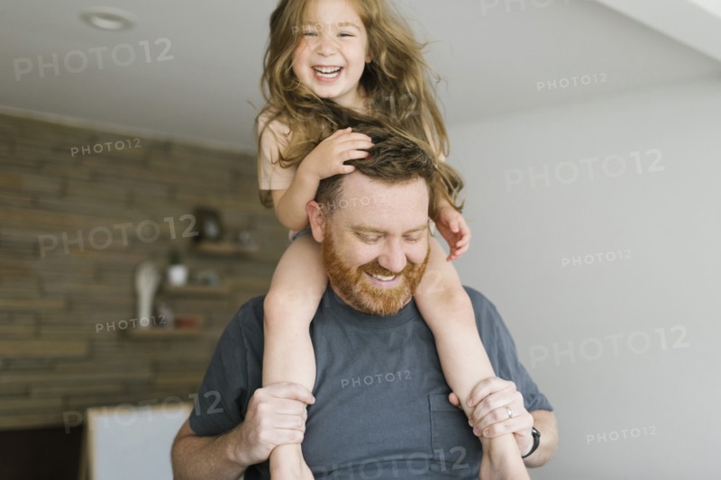 Father carrying daughter