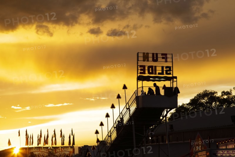 Amusement park rides at sunset