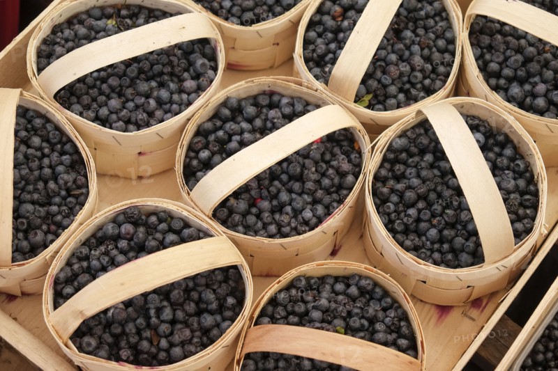 Baskets with blueberries at farmers market