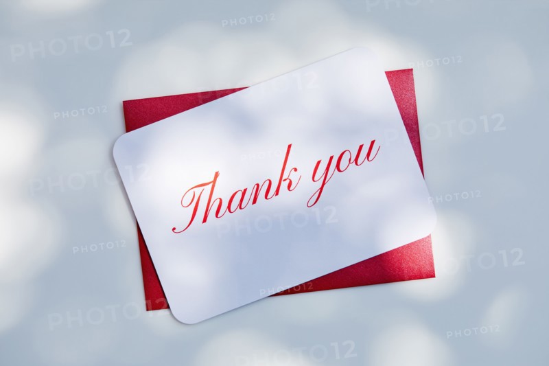 Overhead view of Thank you card and envelope