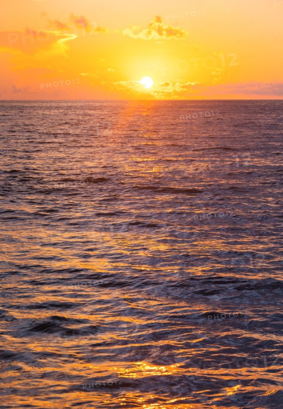 Ocean surface reflecting sunlight at sunrise