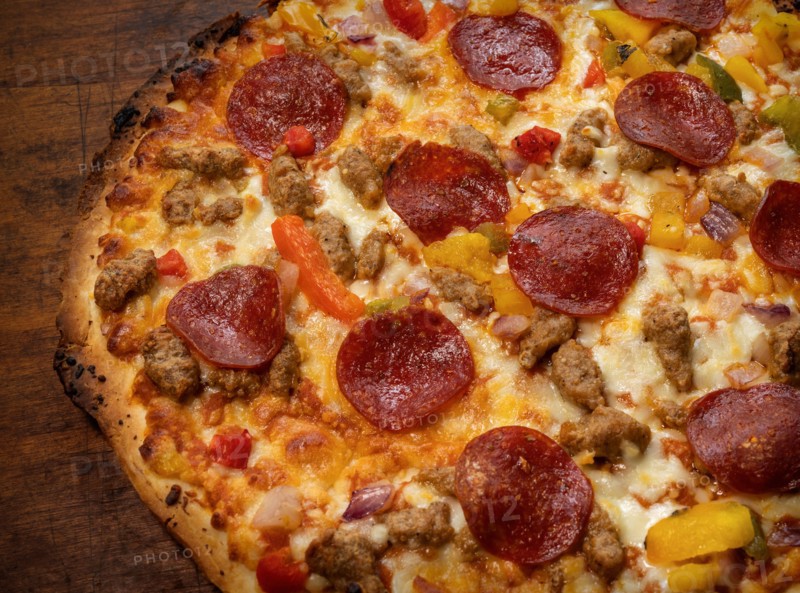 Close-up of pizza on wooden table