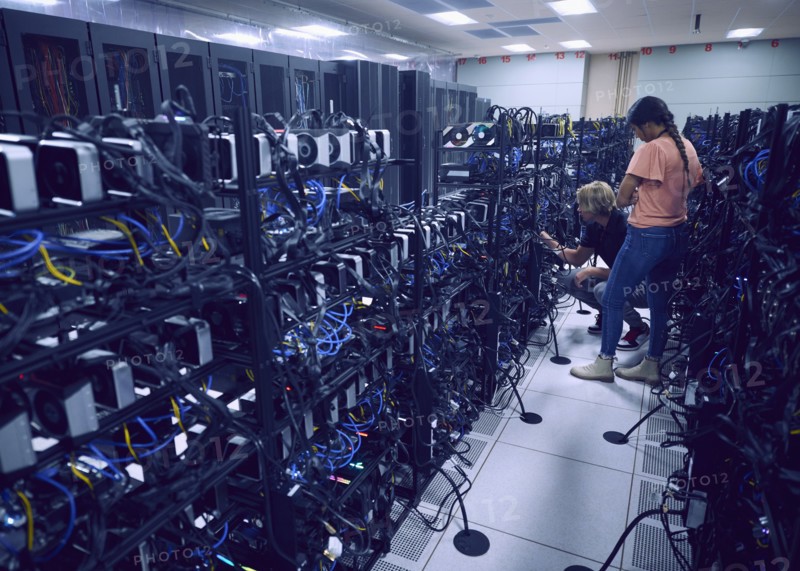 Technicians working in server room