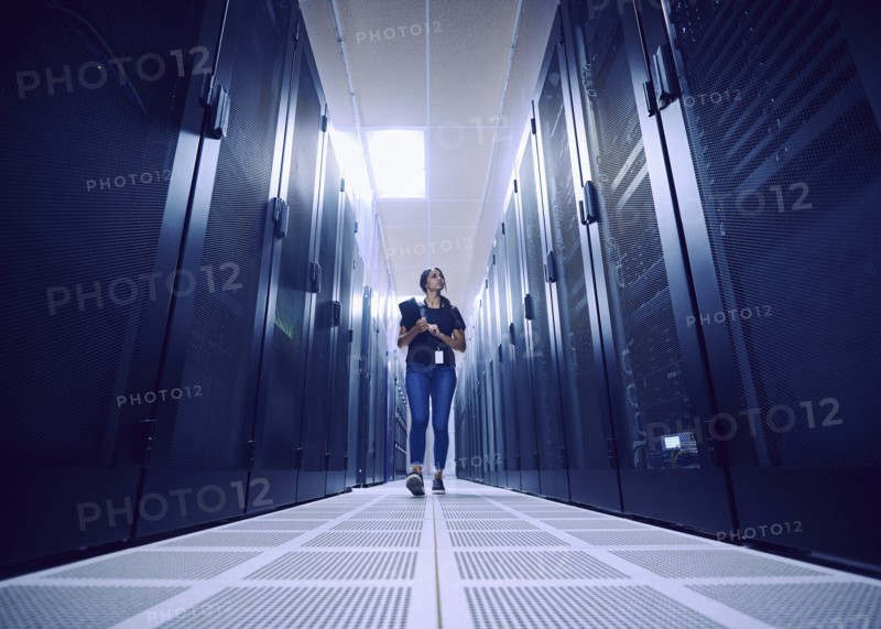 Female technician walking in server room