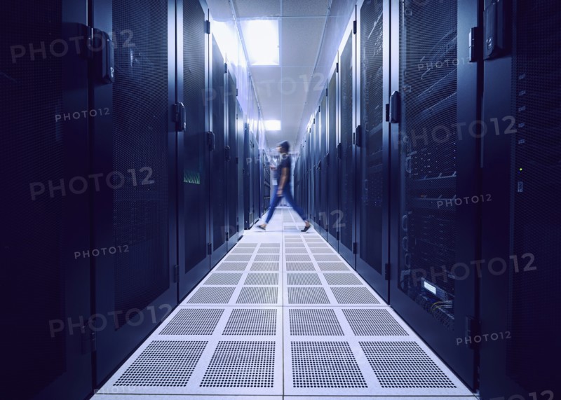Female technician walking in server room