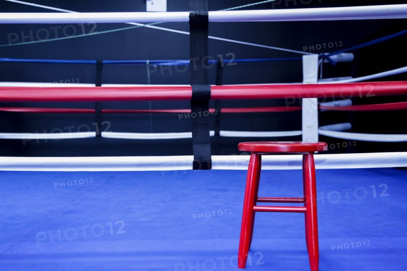 Red stool in boxing ring