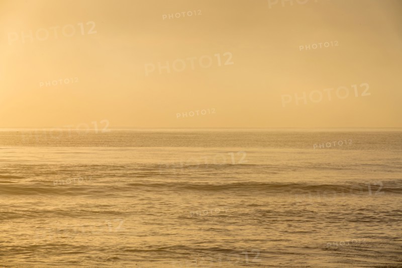 Calm ocean at sunrise