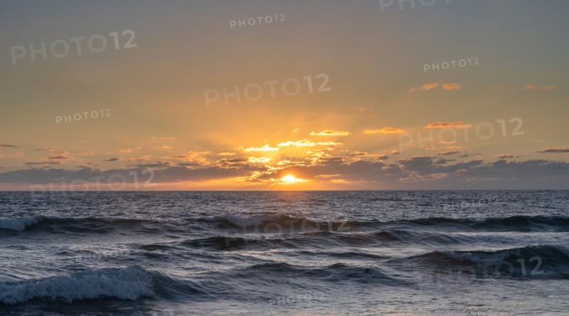 Ocean waves at sunset