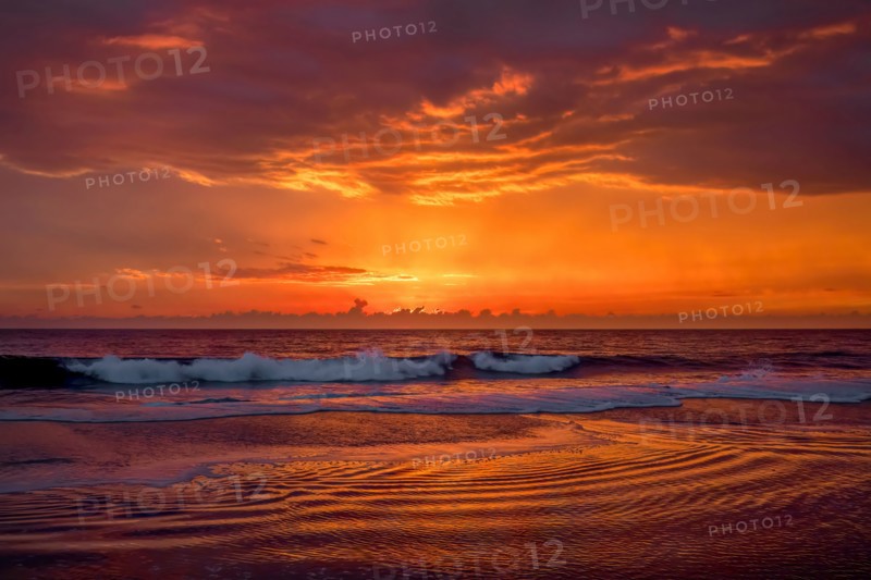 Dramatic sunset sky above ocean