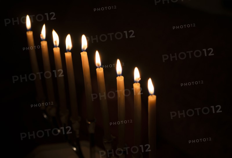 Row of candles against black background