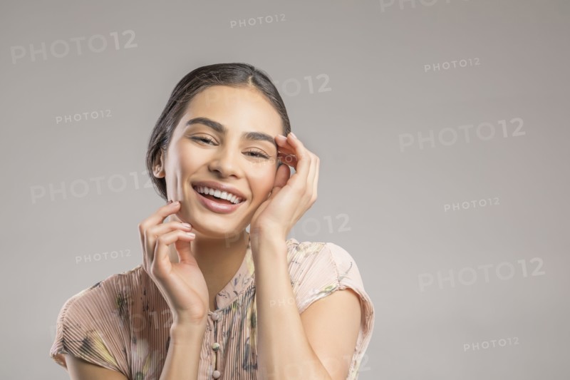 Studio portrait of happy beautiful woman
