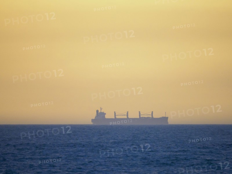 Container ship cruising on calm sea