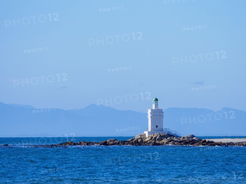 White lighthouse on sea coast