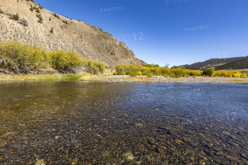 Smooth clear creek in valley