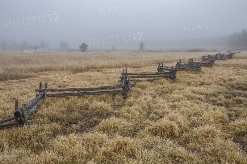 Rail fence in rural scenery at fall