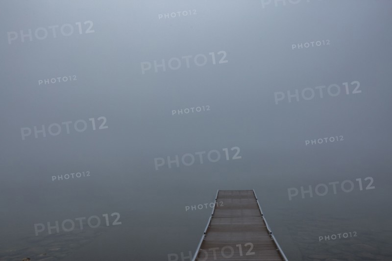 Empty jetty in calm lake