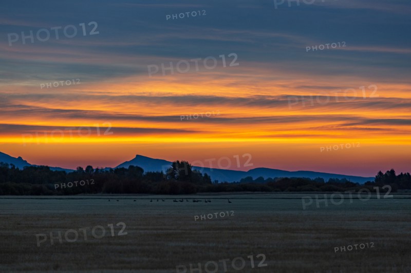 Sky at sunrise over foothills