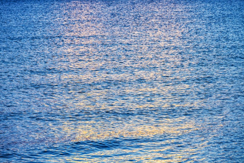 Calm ocean surface reflecting sunlight