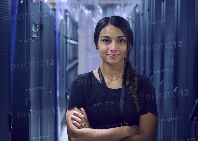 Portrait of smiling female technician in server room