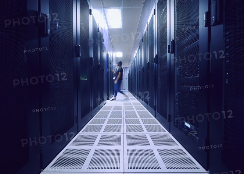 Female technician walking in server room