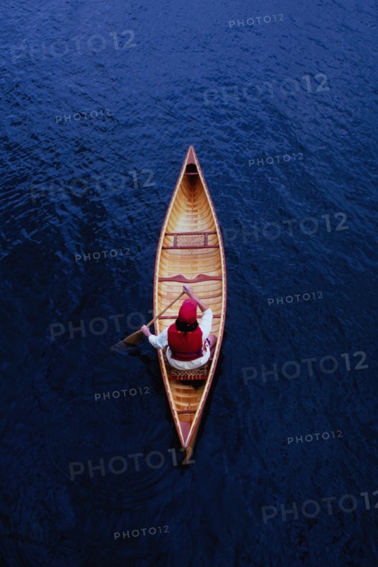 Overhead view of woman paddling canoe on Lake Placid