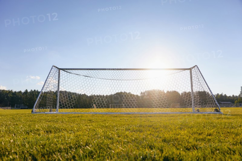 Soccer goal in field in sunshine