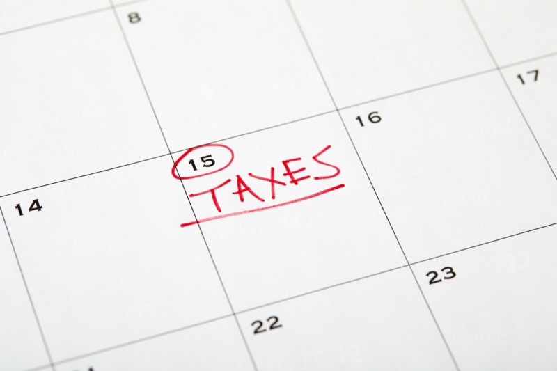 Tax day marked on wall calndar in red