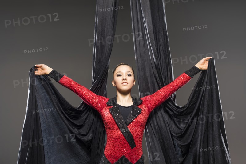 Teenage girl (14-15) performing aerial silk