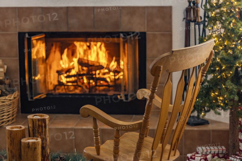 Holiday living room with fireplace and wooden rocking chair