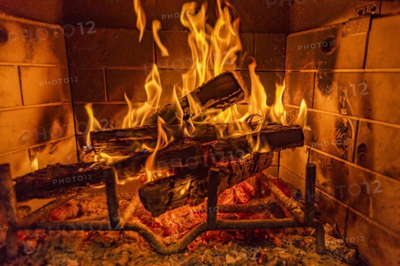 Close-up of fireplace burning wood