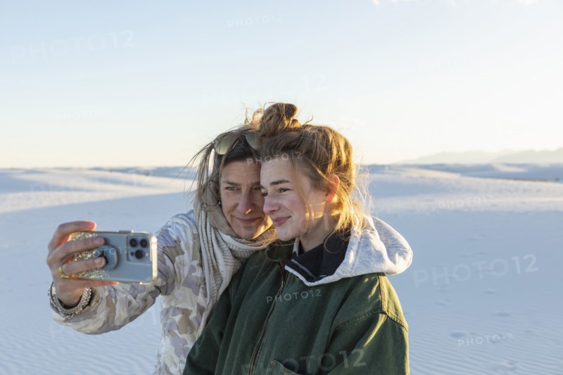 Mother and teen daughter taking selfie White Sands National Park