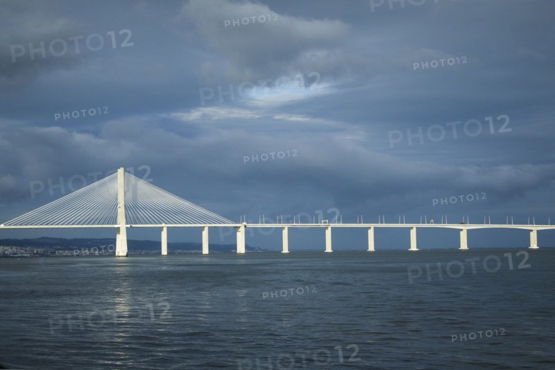 Vasco de Gama bridge under cloudy sky
