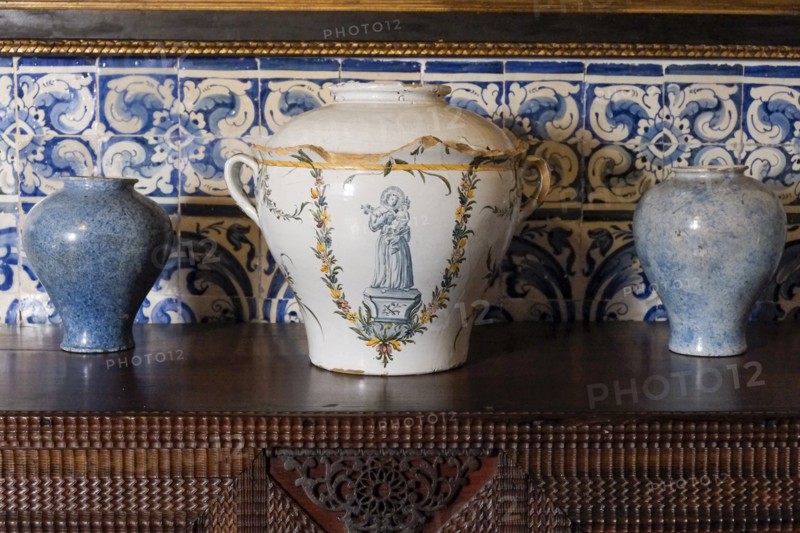 Antique Portuguese clay pots with blue tile background