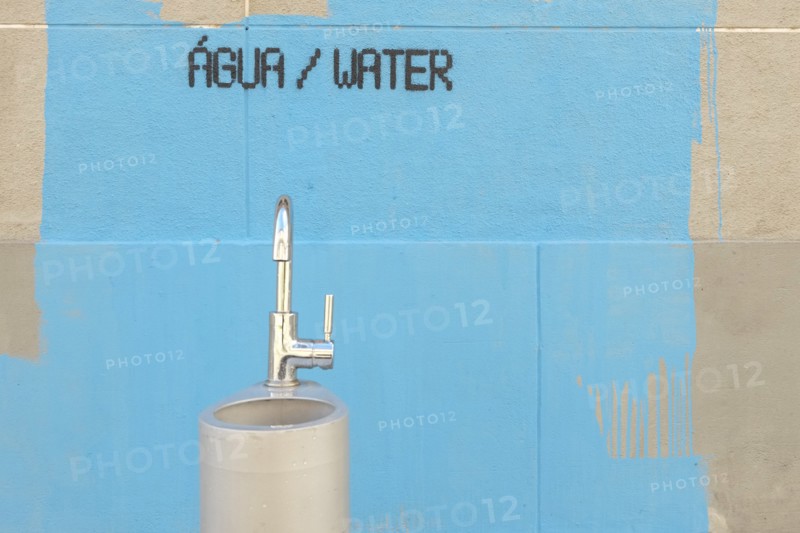 Water fountain and painting on wall