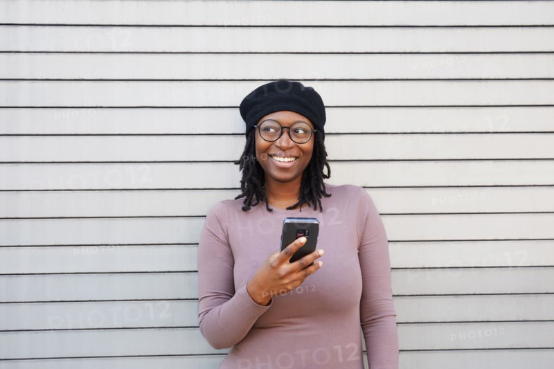 Smiling woman wearing eyeglasses and beret